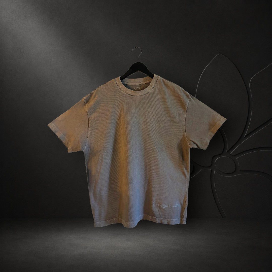 KA'EO Apparel charcoal oversized heavyweight cotton t-shirt with embroidered heritage + culture detail on hem