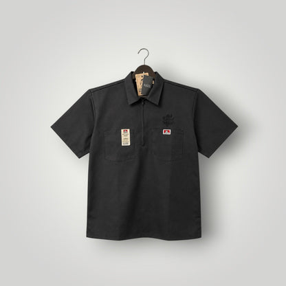 KA'EO Apparel black poly-cotton twill short sleeve work shirt with quarter-zip and two chest pockets.