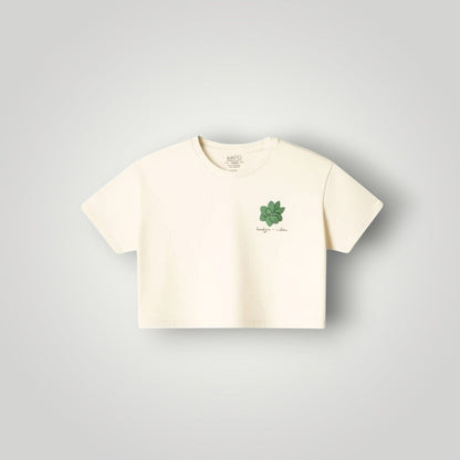 KA'EO Apparel cream cotton cropped t-shirt with olive green sampaguita graphic on chest.