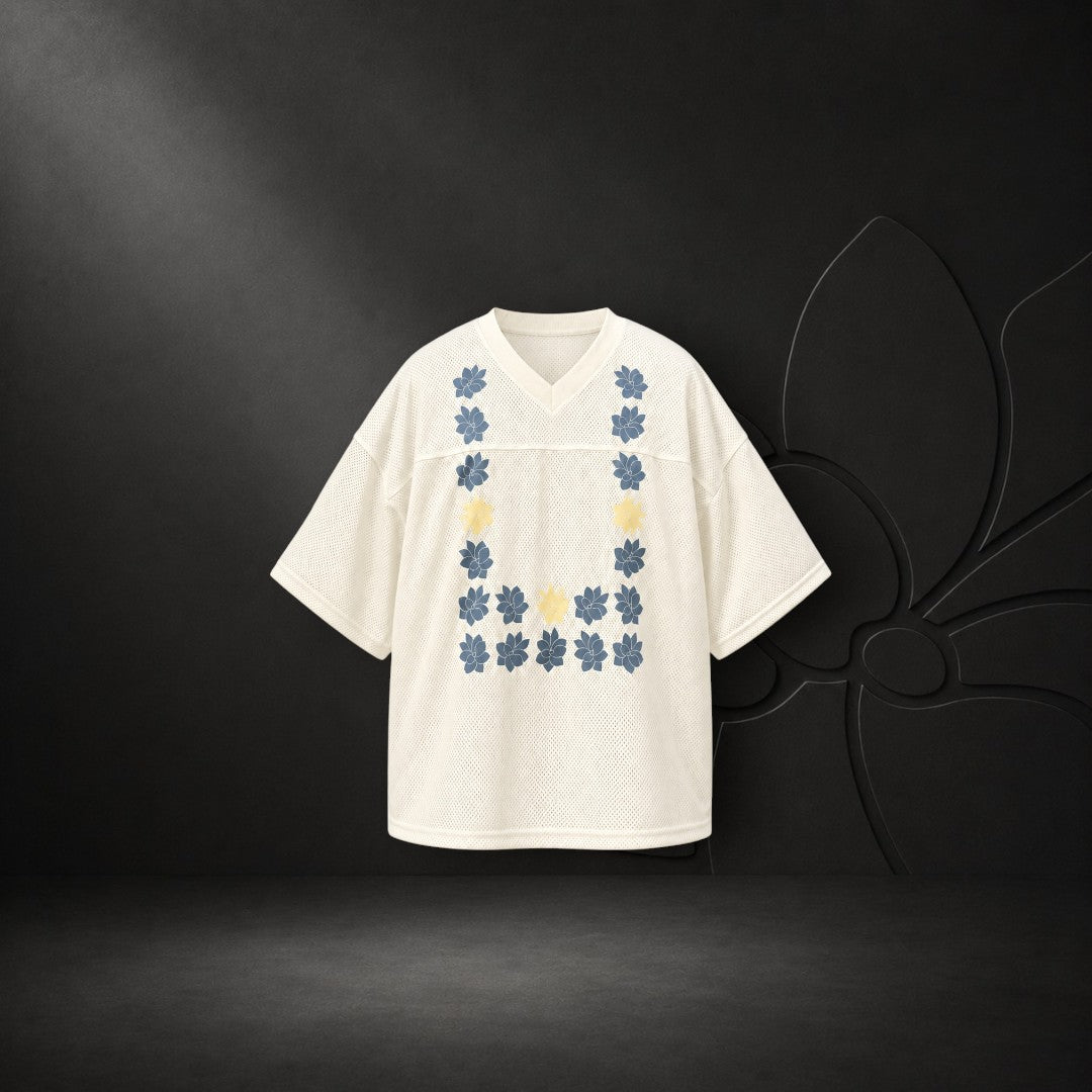 KA'EO Apparel cream mesh cropped football jersey with blue and yellow Sampaguita flower graphic in a U-shape design