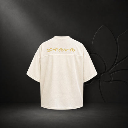 Back view of KA'EO Apparel cream mesh cropped football jersey featuring gold Baybayin script across the shoulders.