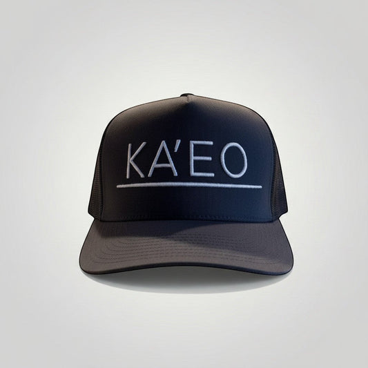 KA'EO Apparel dark grey trucker hat with white embroidered logo and mesh back panels.