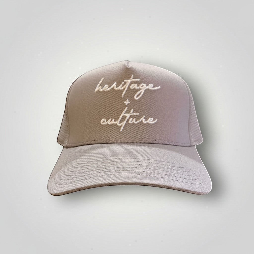 KA'EO Apparel gray cotton snapback cap with embroidered 'heritage + culture' text and curved brim.