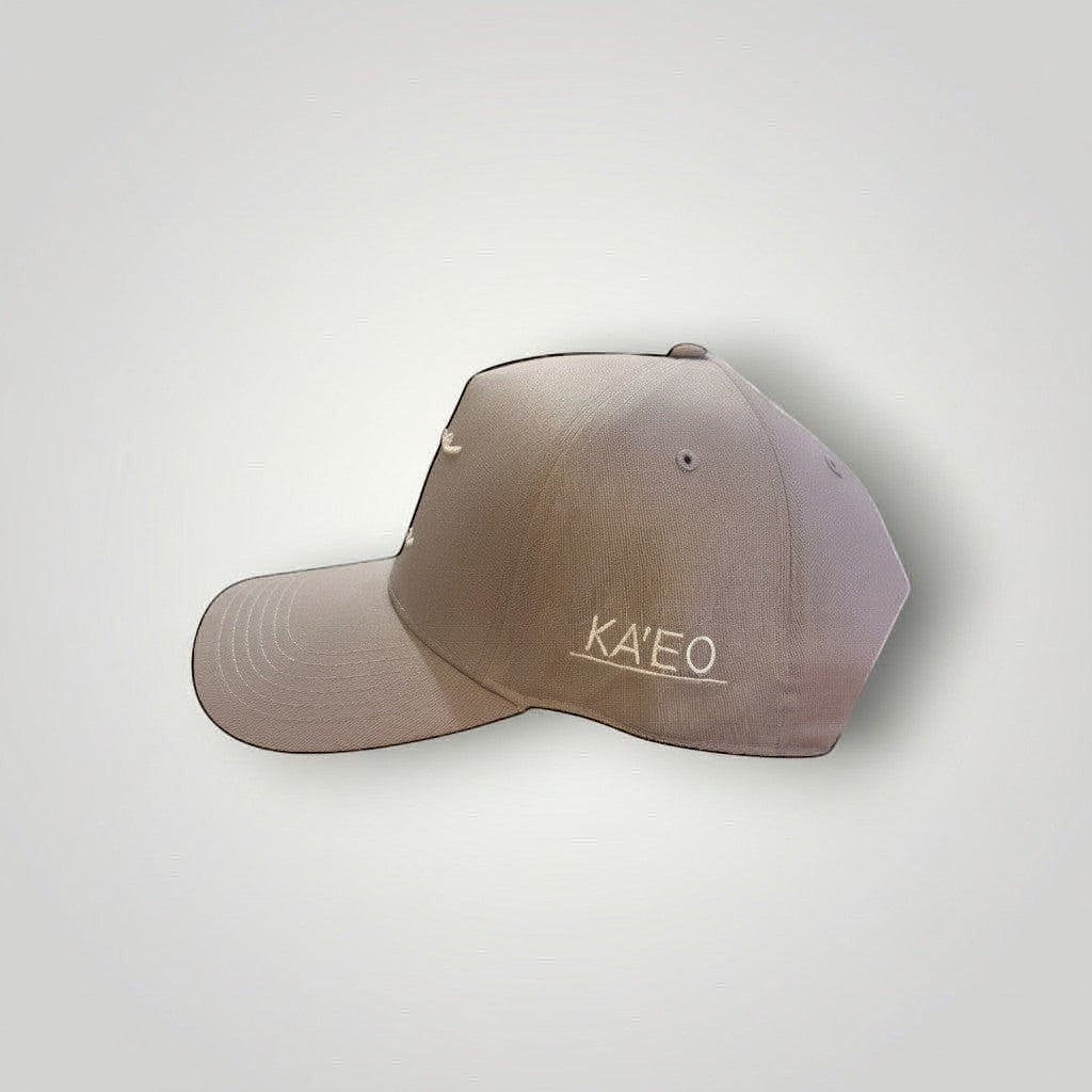 KA'EO Apparel gray cotton snapback cap with embroidered 'heritage + culture' script and side branding.