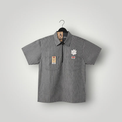 KA'EO Apparel grey pinstripe short-sleeve butcher shirt with quarter-zip, two chest pockets, and floral embroidery.