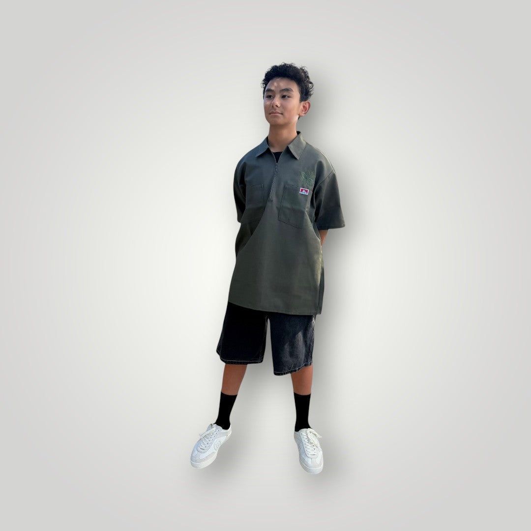 KA'EO Apparel olive drab short-sleeve work shirt with quarter-zip and embroidered logos on chest pockets.