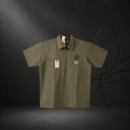 KA'EO Apparel olive drab short-sleeve work shirt with quarter-zip, two chest pockets, and embroidered logos.